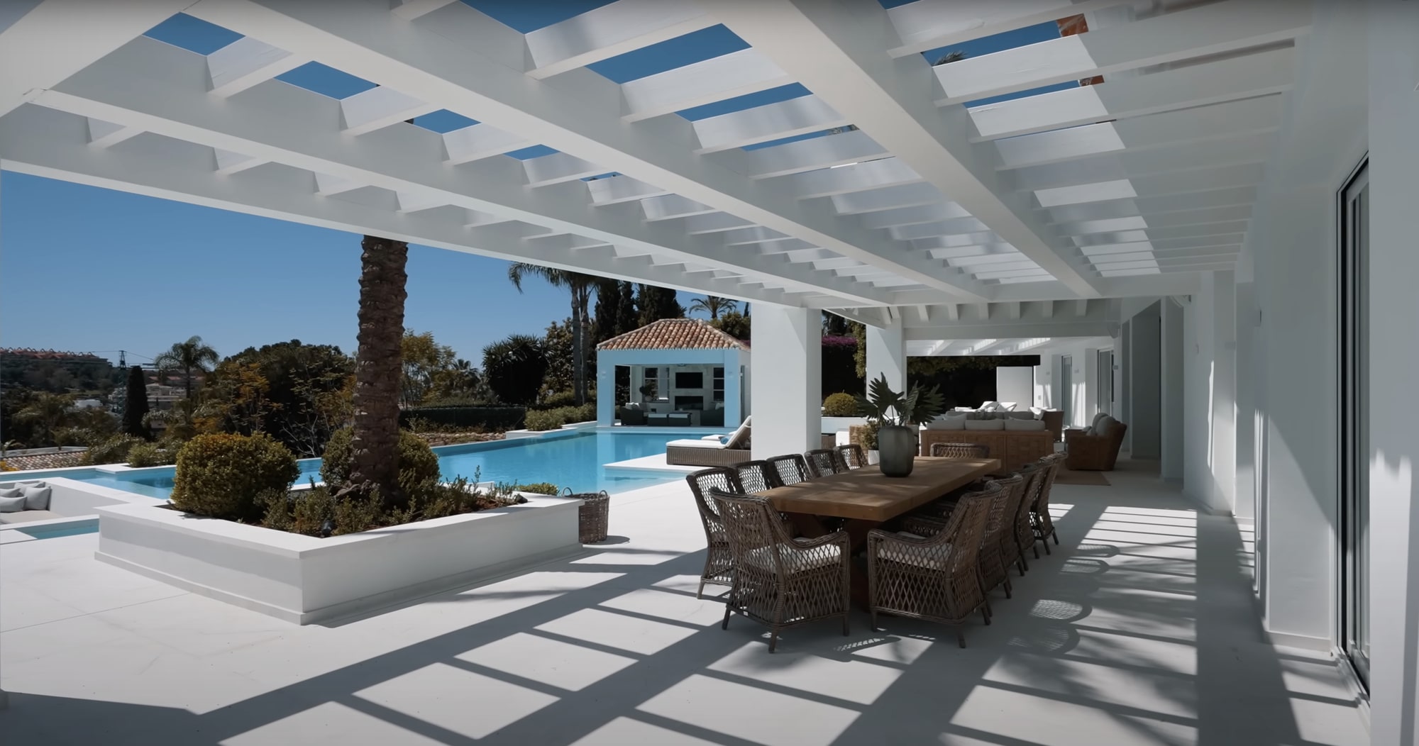 Open-air dining pavilion with garden views