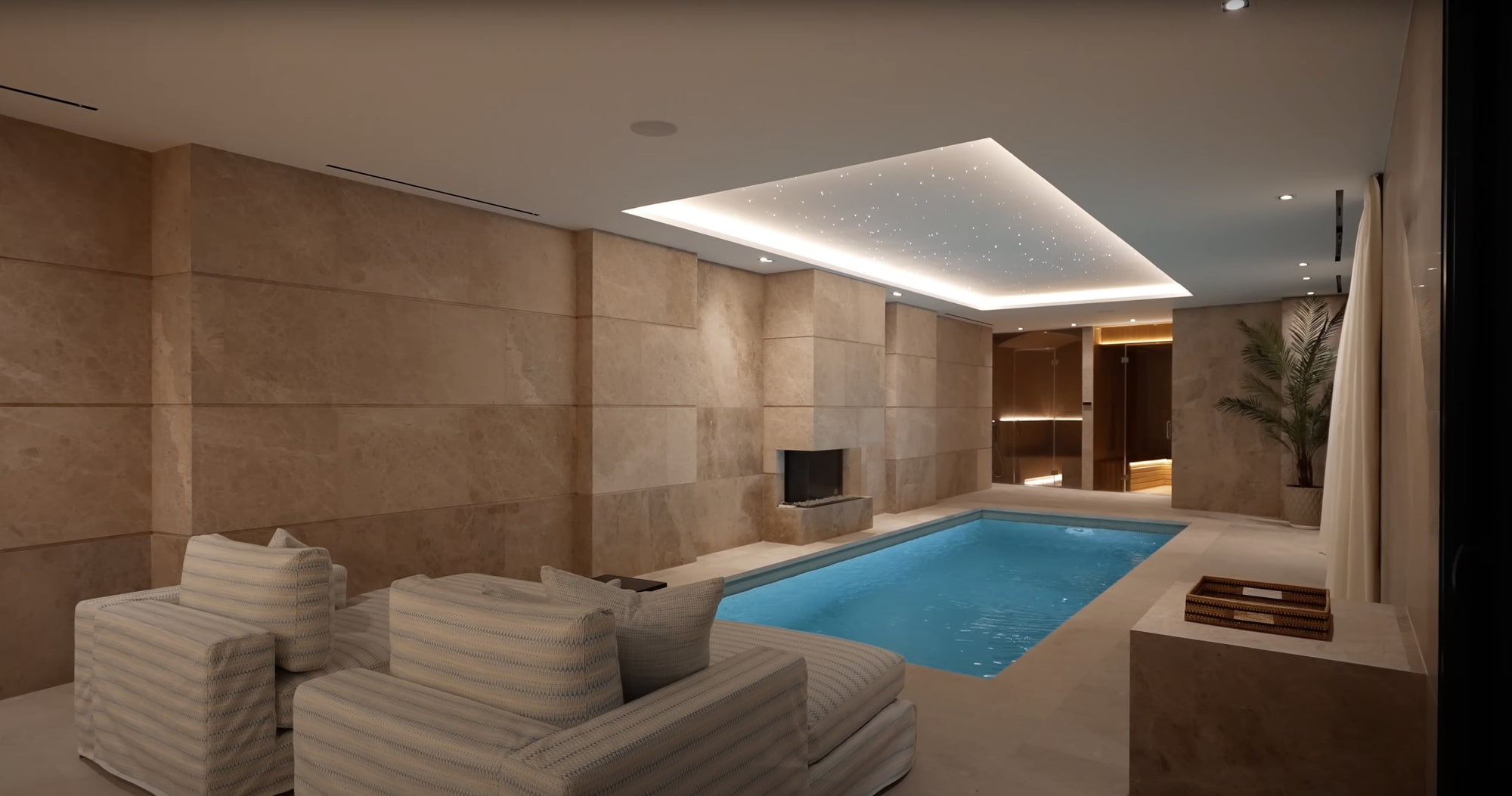 Walkway to sunken seating area surrounded by water