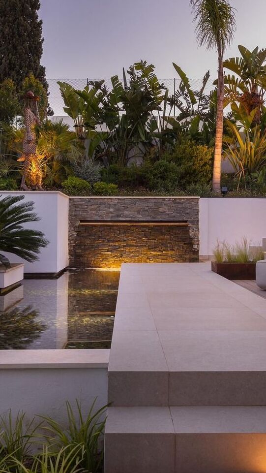 Sun loungers by the pool facing living areas