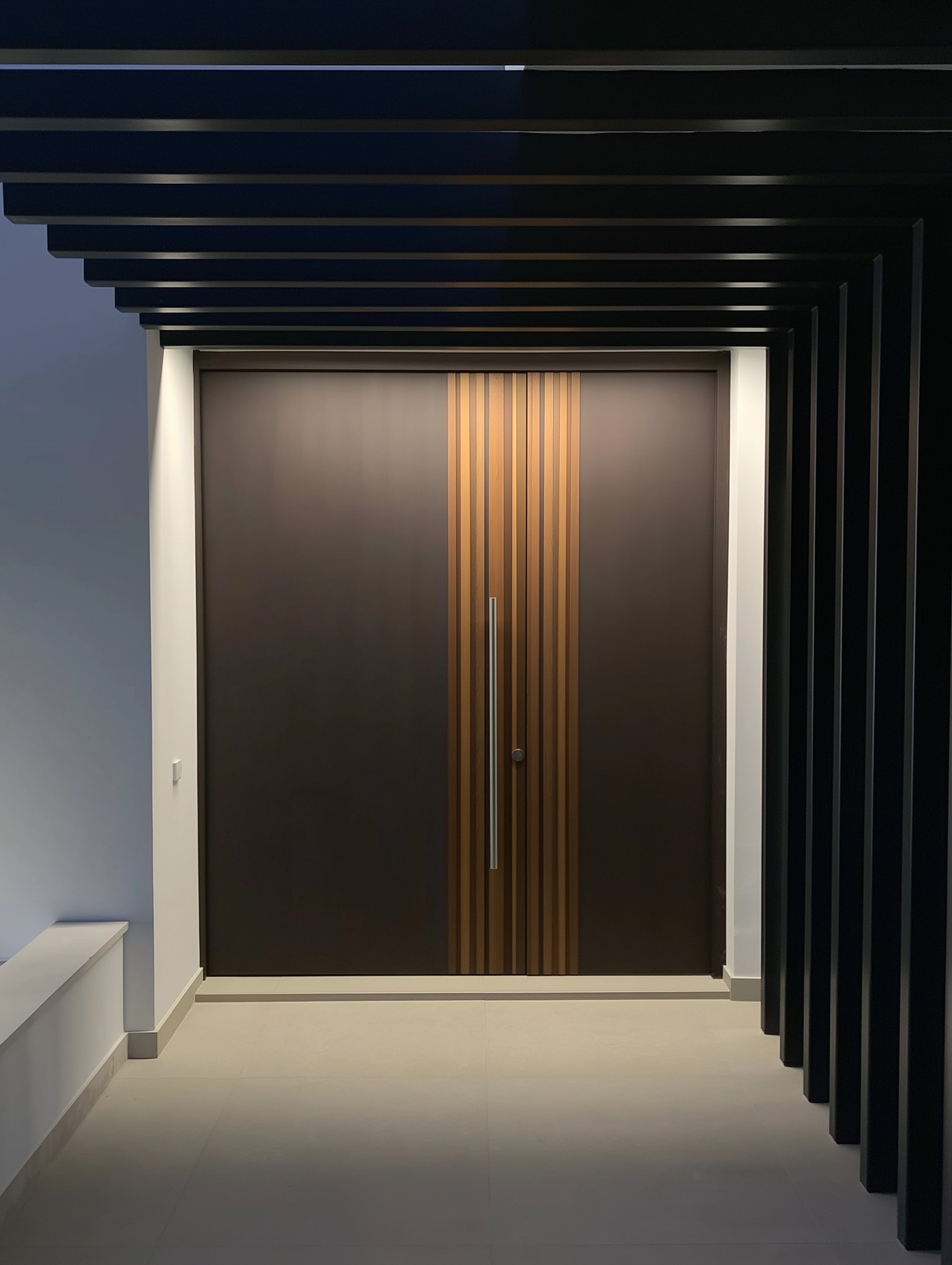 Wood-beamed ceiling above integrated social areas