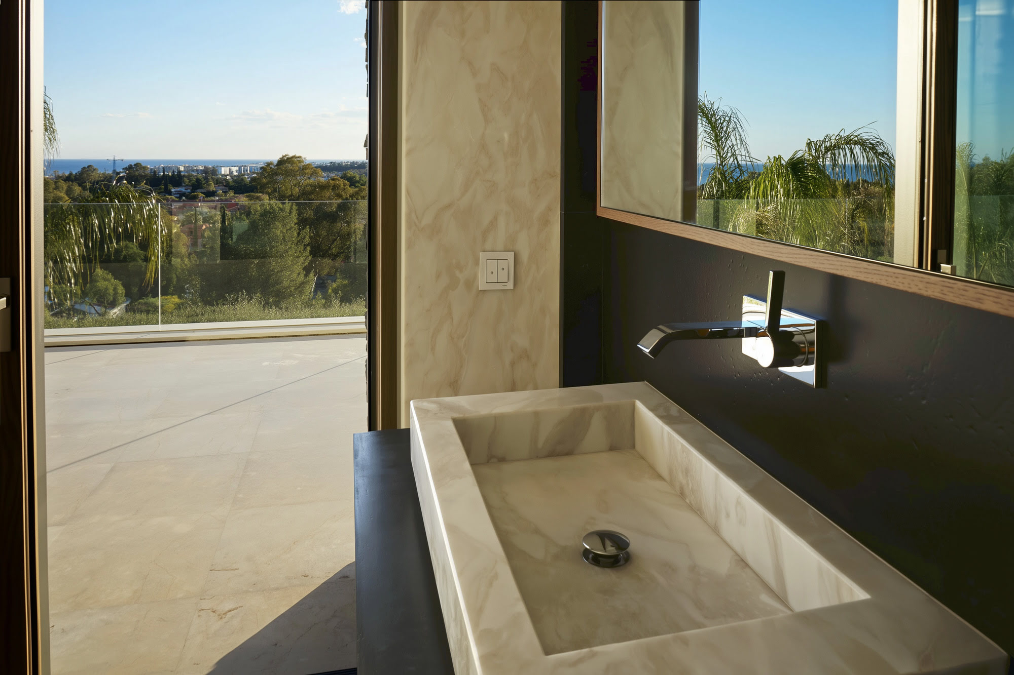 Natural textures and warm palette in interior finishes