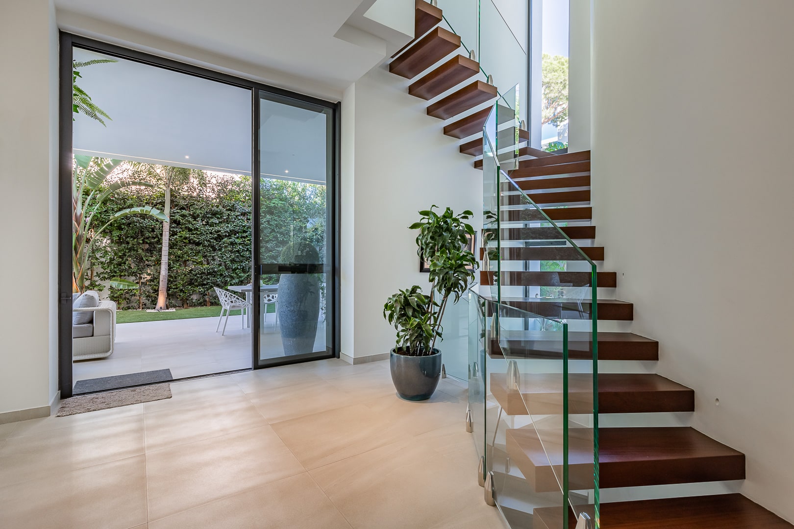 Modern open kitchen with views to garden and pool