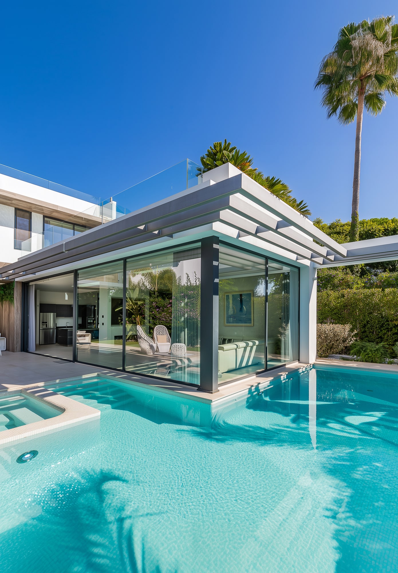 Infinity pool wrapping around social area with loungers