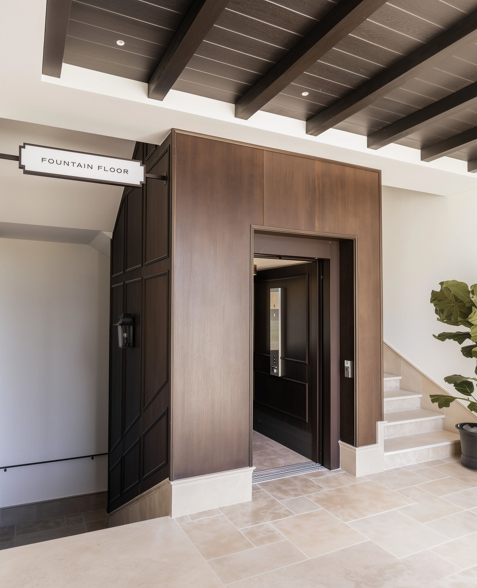 Detail of classical-inspired architecture with awnings and arched windows