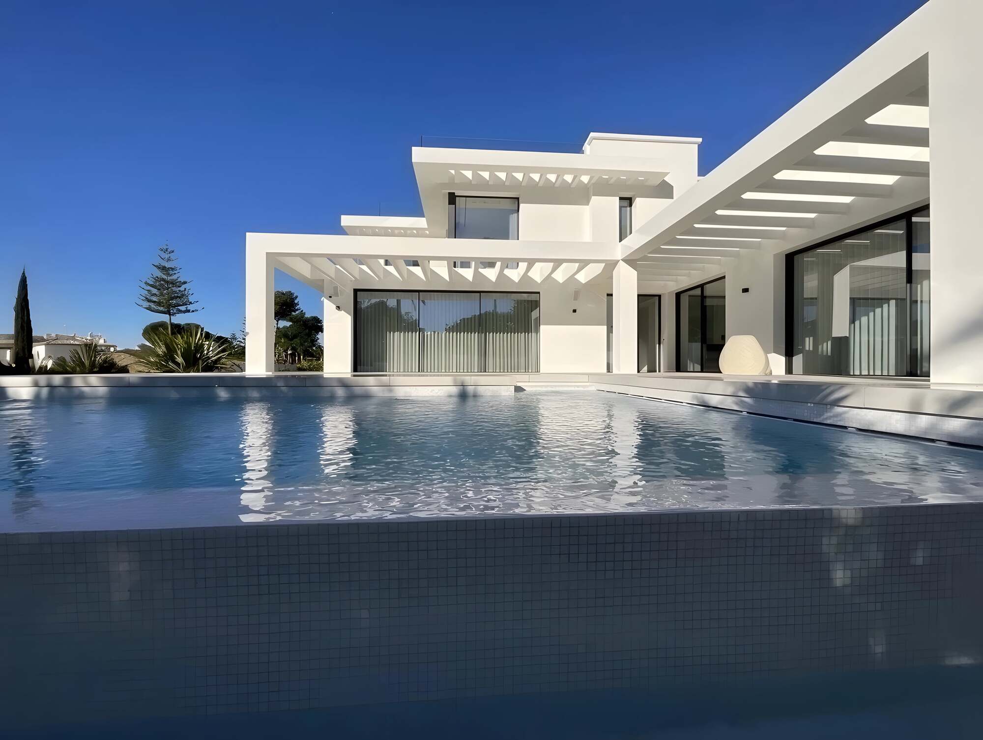 Floating white geometry surrounded by tropical garden