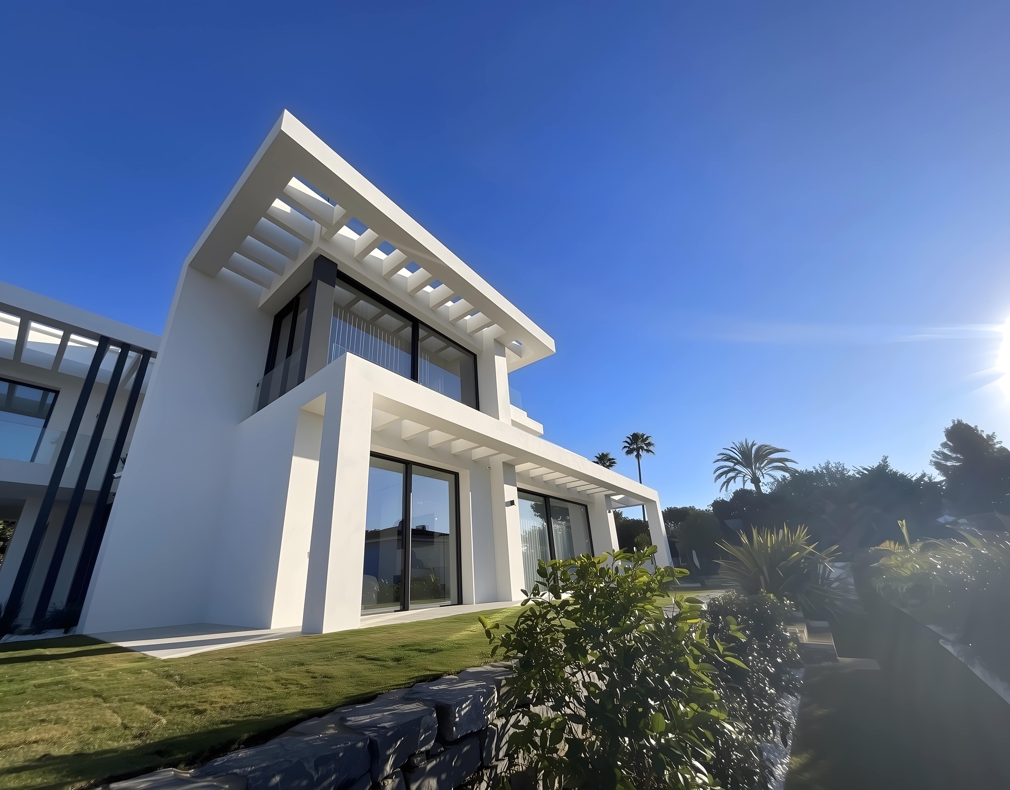 Entry pathway integrated into landscape with white stone
