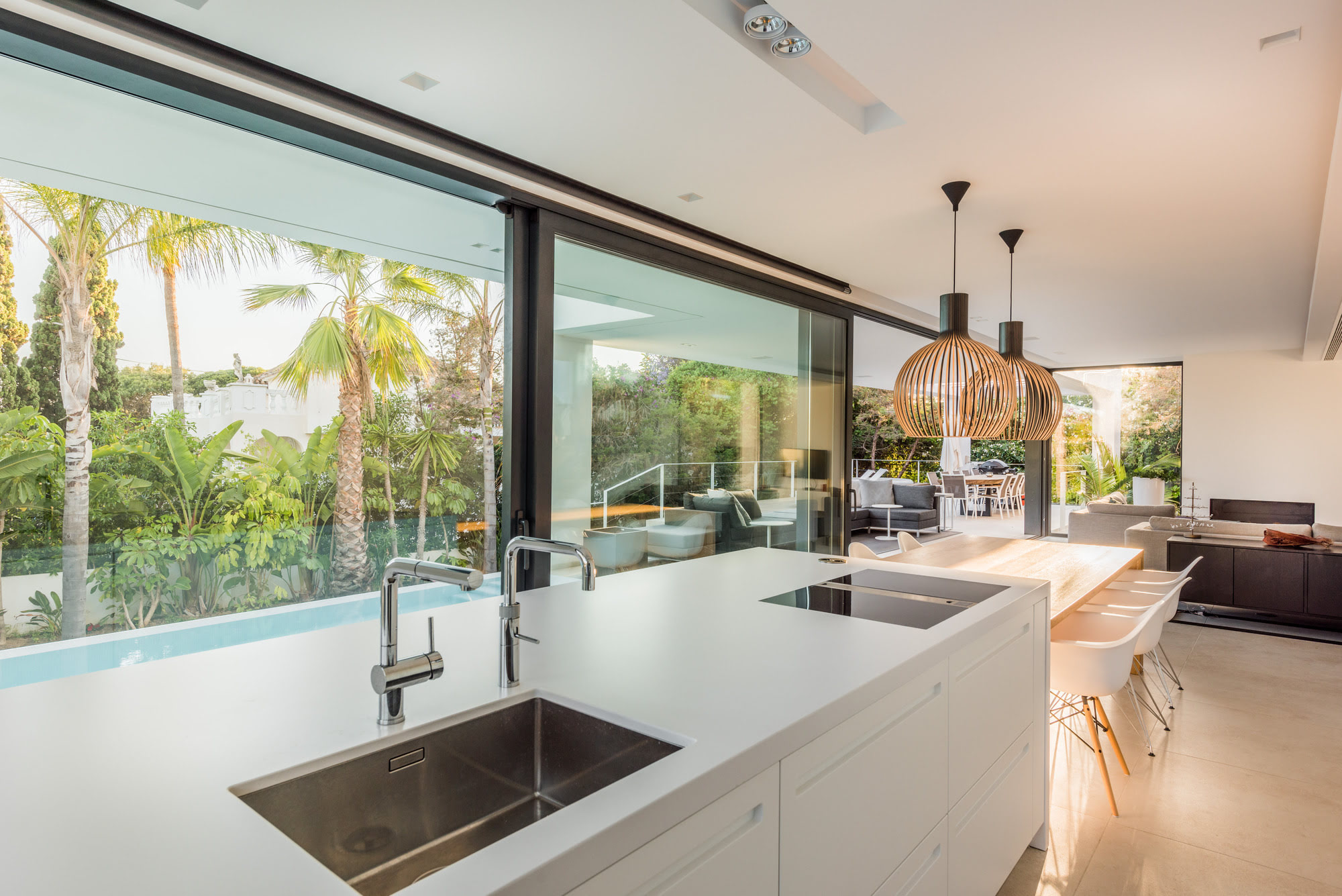 Night lighting of M152 façade with tropical silhouettes