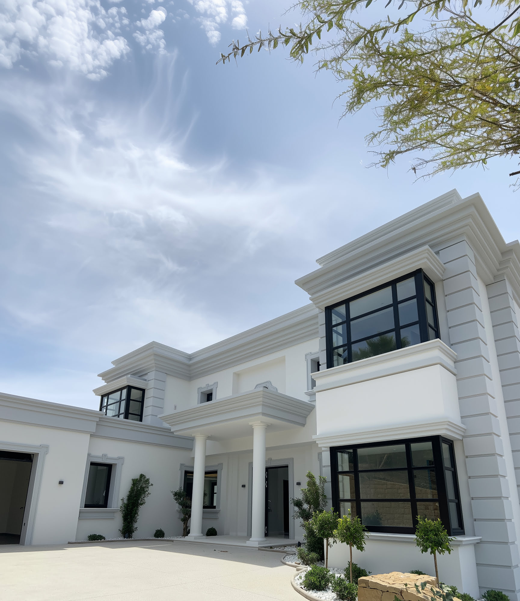 Main living room featuring classical ceiling details
