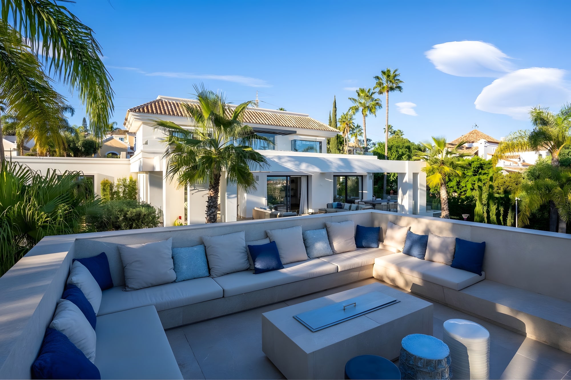 Evening glow across terrace and water feature in CASA DE LAS PALMERAS