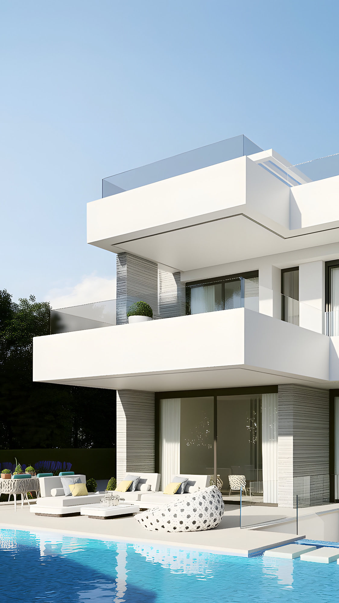 Terrace with lounge chairs and water detail at pool edge