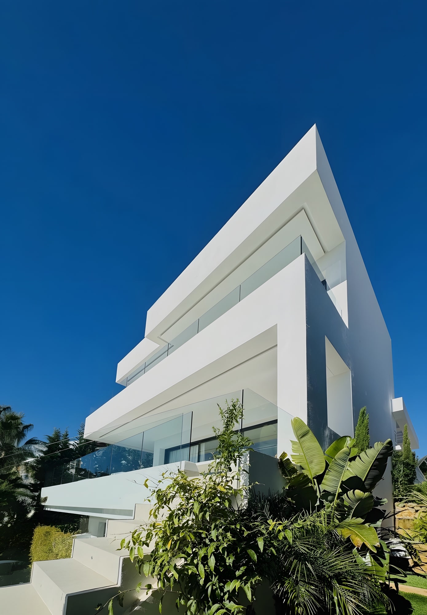 Staircase with clean lines and frameless glass railing