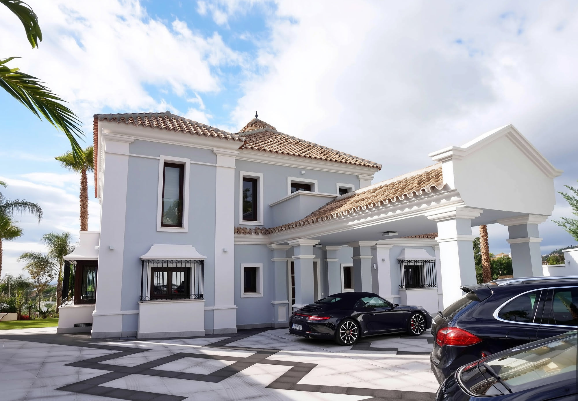 Poolside view of villa with Mediterranean structure