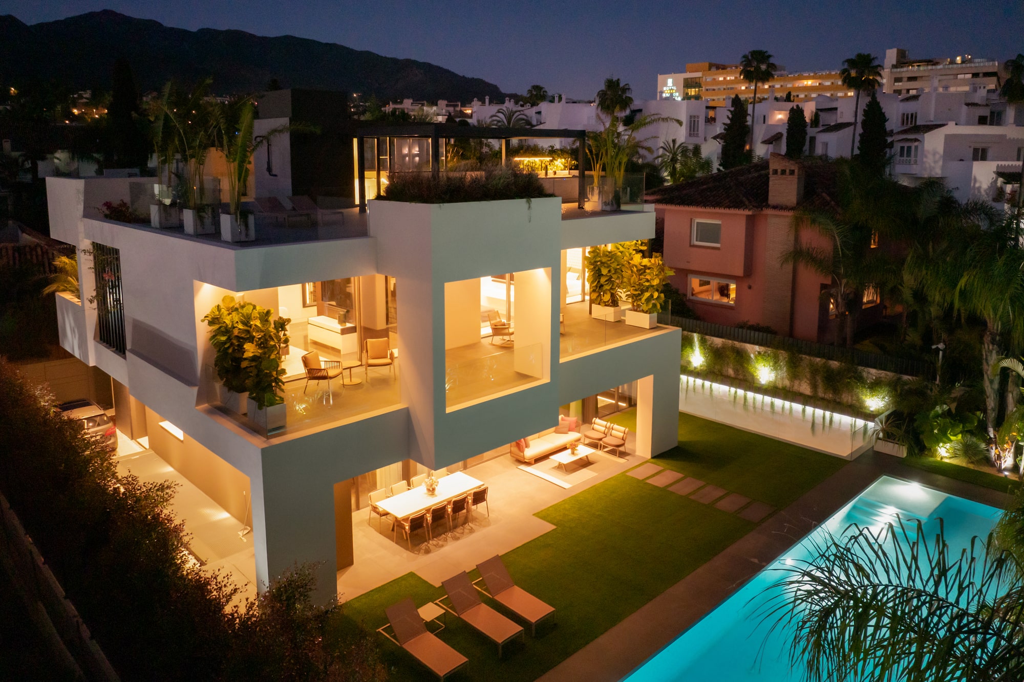 Open plan lounge with full-height windows and serene palette