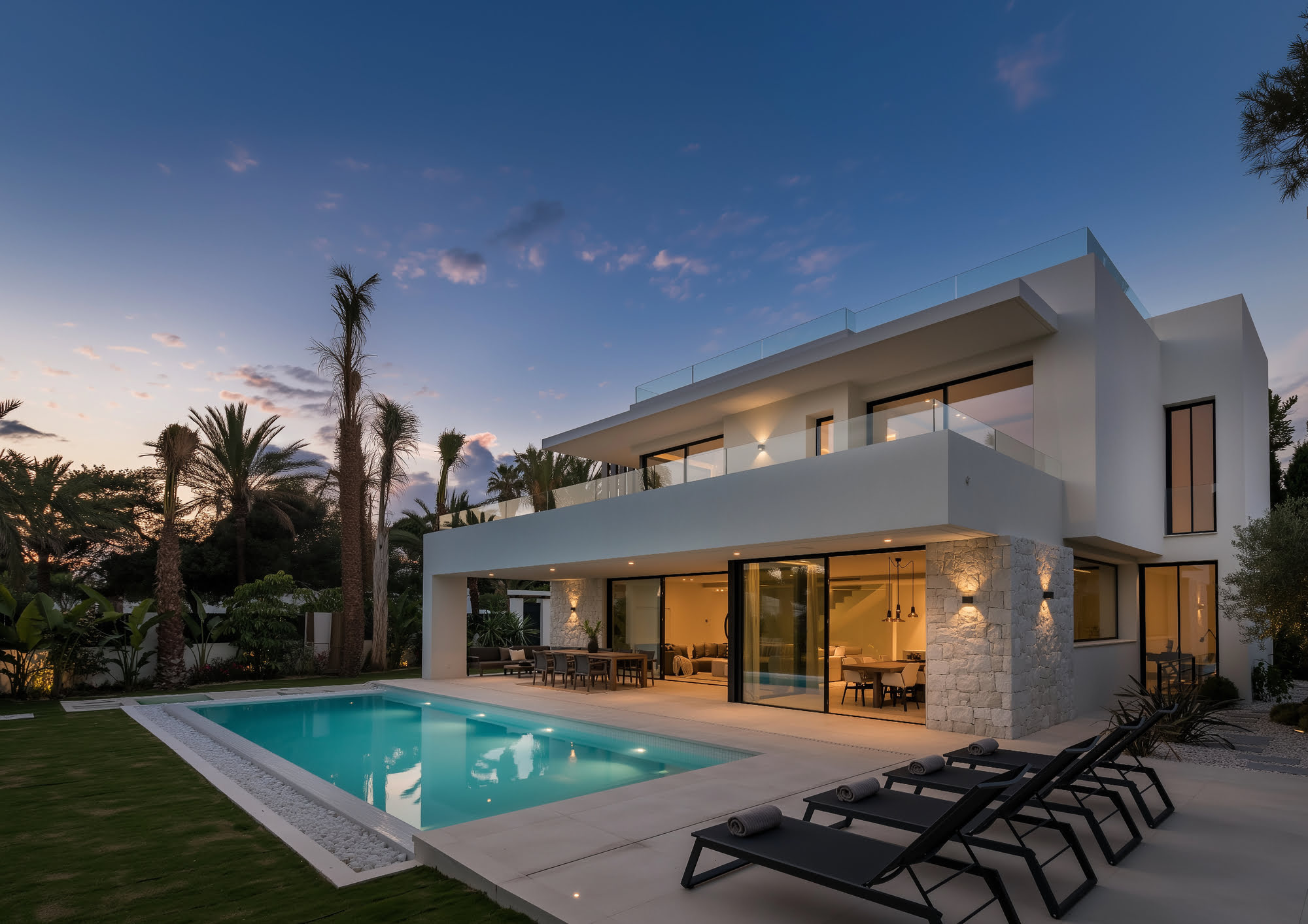 Glass stairwell and double-height entrance flooded with light