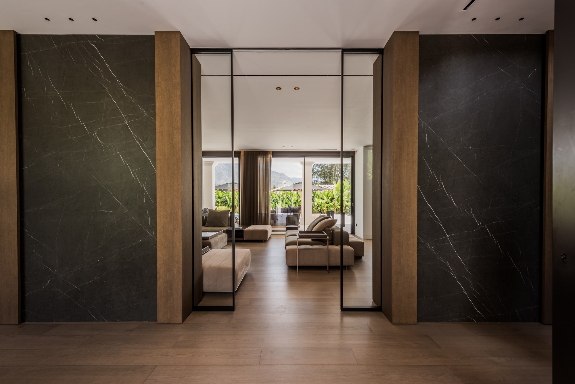 Textured stone walls and wooden accents in VILLA ZARINA lounge