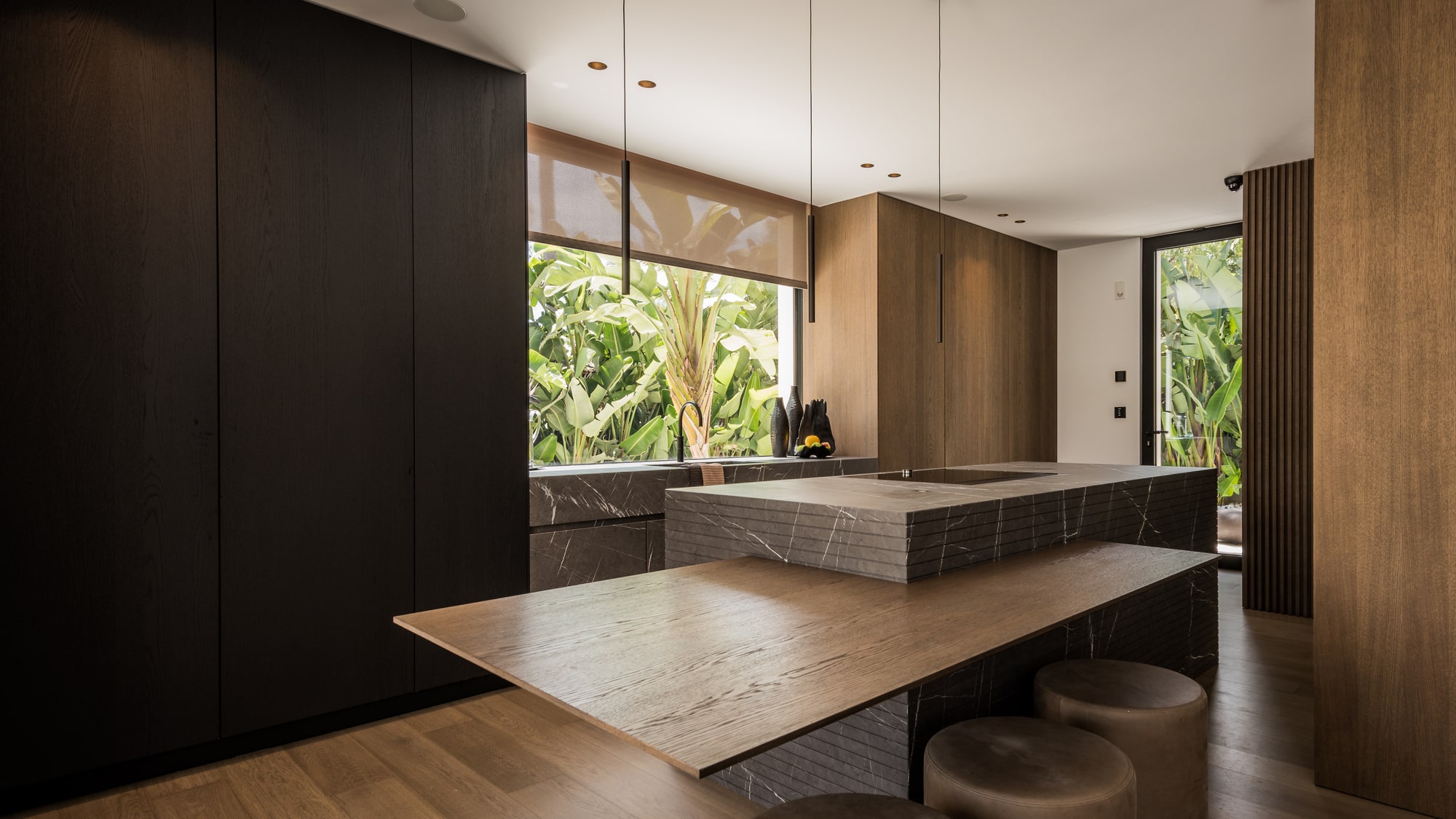 Master suite featuring private terrace access and warm neutral tones